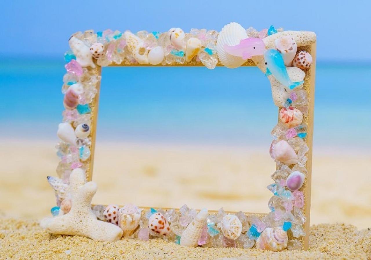 Hotel Monterey Okinawa Spa & Resort Onna Exterior foto A seashell frame